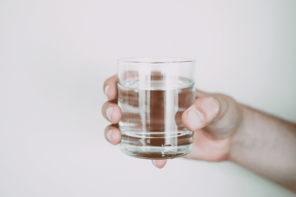 Glass of water representing water fasting as a natural approach to cancer prevention and treatment support